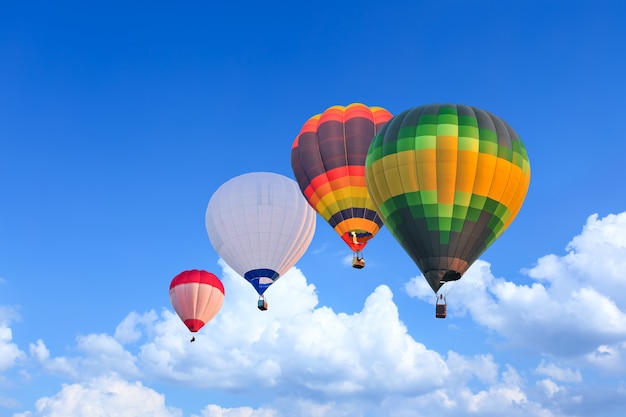 Colorful Hot Air Balloons in Flight over blue sky