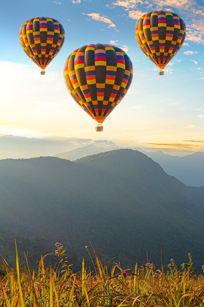 Colorful hotair balloons flying over the mountain