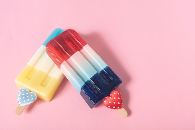 Colorful an ice cream on pink pastel background. Summer minimal creative idea.