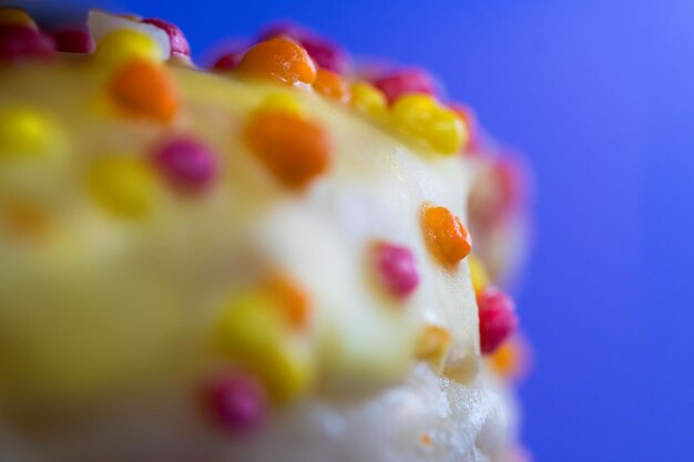 Colorful icing cookie elements Donut on pastel background Macro photography