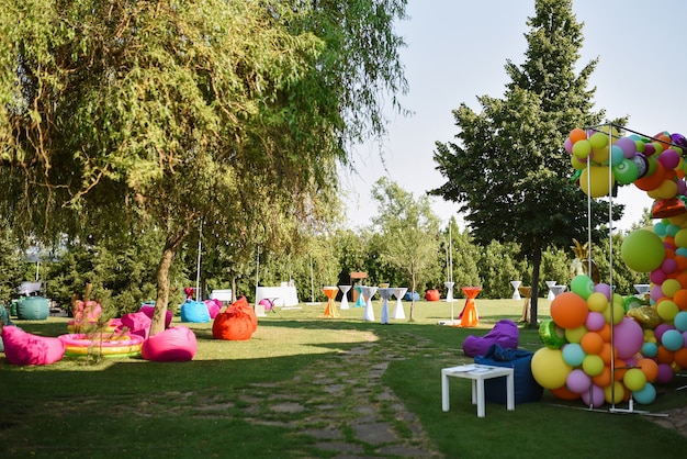 Colorful, inflatable, soft seating areas on the lawn before the party