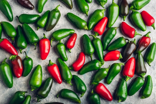 Colorful Jalapeno Peppers on Concrete Background