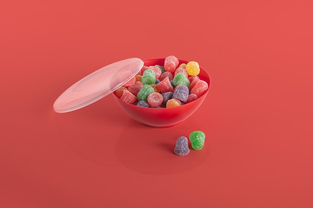 Colorful jelly bean in bowl isolated on colorful background