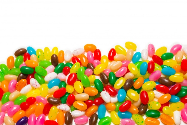 Colorful jelly beans white background. Top view.