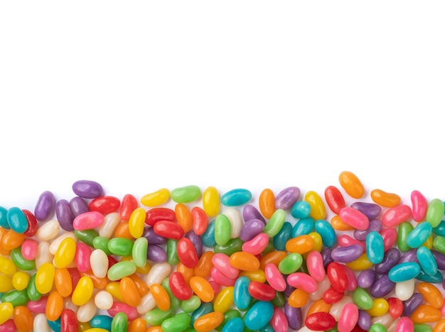 Colorful jelly beans over white background with copy space