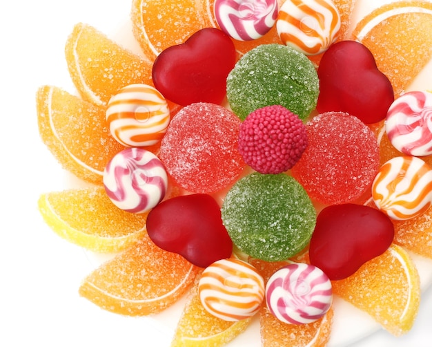 Colorful jelly candies on plate isolated on white