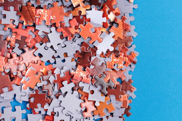 Colorful jigsaw puzzle on blue background