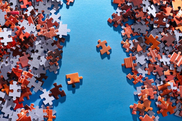 Colorful jigsaw puzzle on blue background