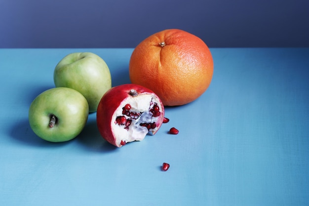 Colorful and juicy fruits on a blue table