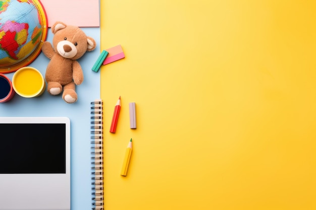 colorful kids' work space online learning with laptop notebooks and teddy bear