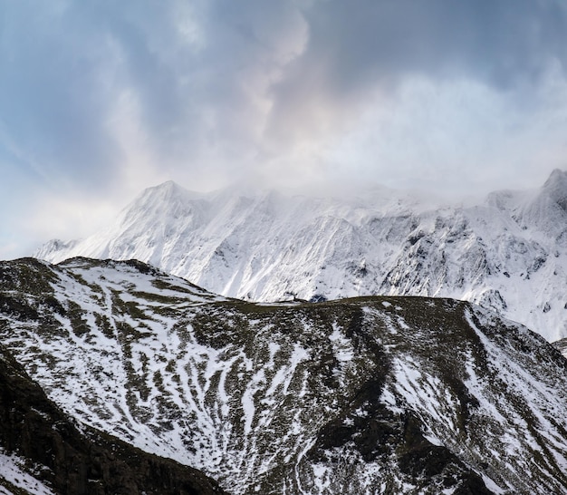 Colorful Landmannalaugar mountains under snow cover in autumn Iceland