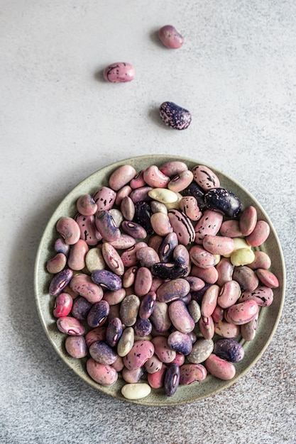 Colorful legumes on ceramic plate Substitution of meat high protein product