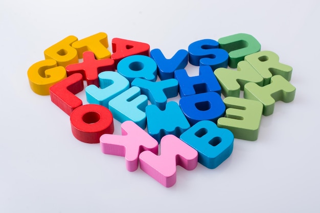 Colorful letter blocks shape heart