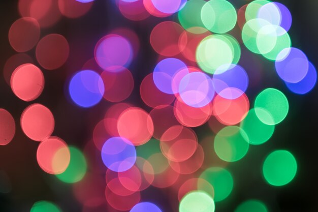 크리스마스와 새 해 복 많이 받으세요 bcakground에 대 한 다채로운 빛 bokeh.