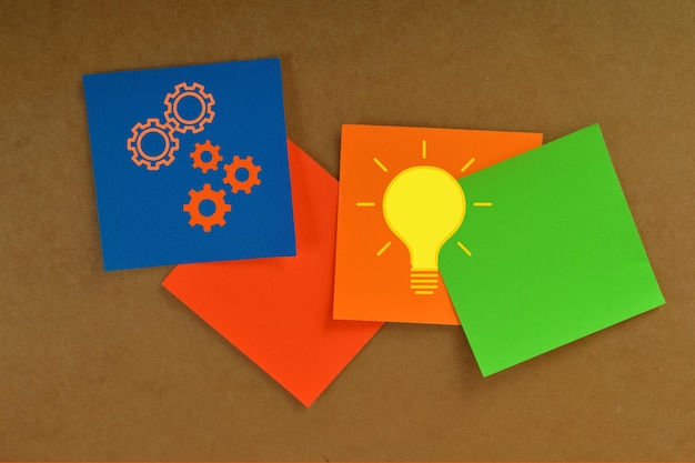 Colorful light bulbs with gears Innovation and ideas concept