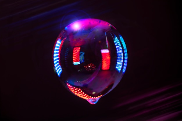 Colorful lights reflecting soap bubble abstraction