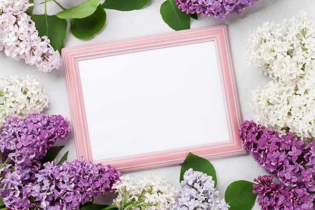 Colorful lilac flowers and photo frame