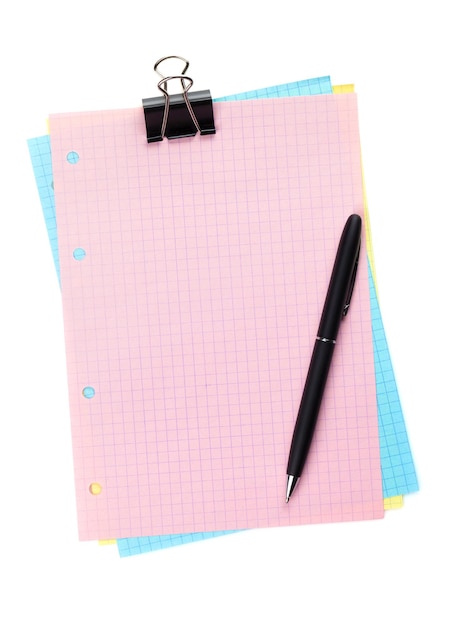 Colorful lined office paper with clip and pen