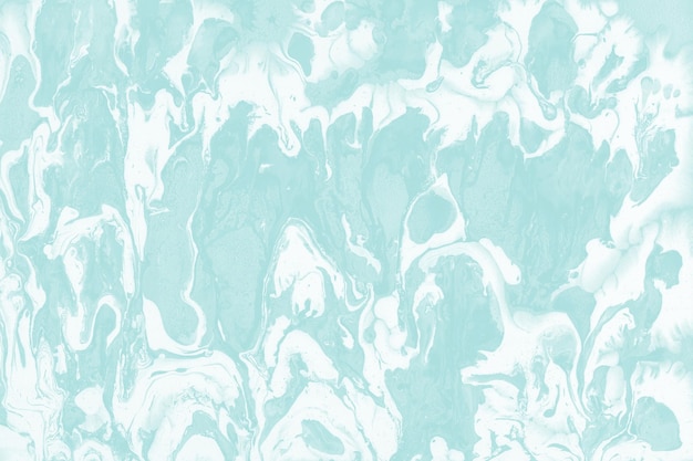 Colorful liquid paint texture on a white paper background