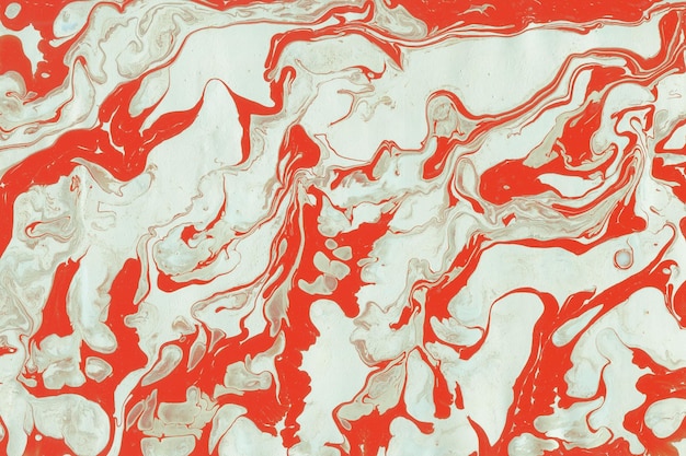 Colorful liquid paint texture on a white paper background