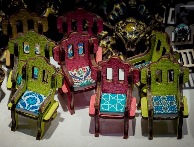 Photo colorful little wooden toy chairs in view