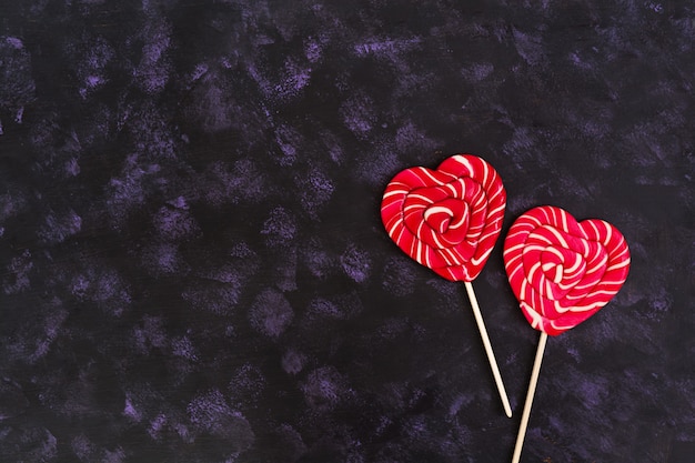 Colorful lollipops on dark