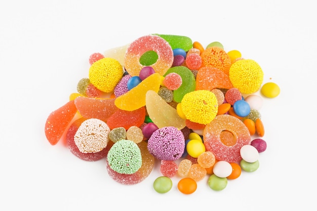 Colorful lollipops and different colored round candy. Top view.