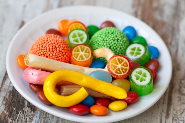 colorful lollipops and different colorful round candy. top view.