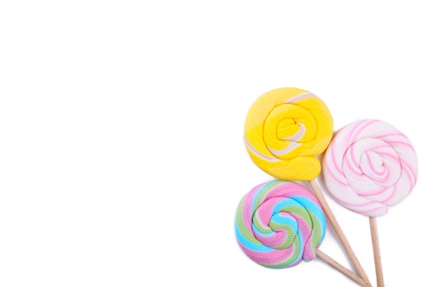 Colorful lollipops isolated on white table. Studio shot