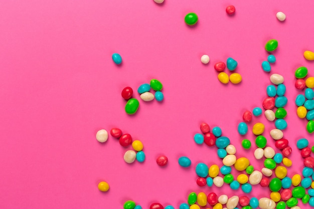 Colorful lollipops on a pink background