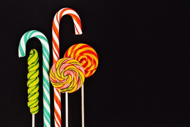 Colorful lollipops and sweets on a black background