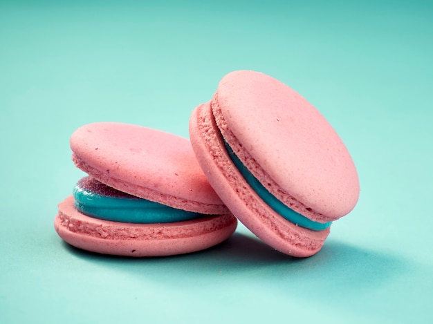 Colorful macarons on a blue background