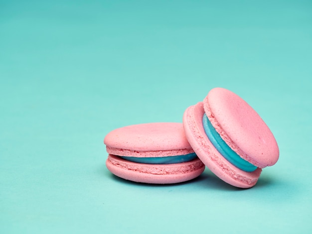 Colorful macarons on a blue background