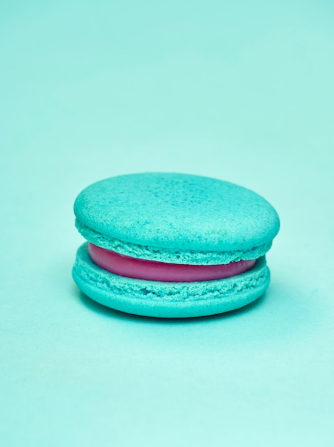 Colorful macarons on a blue background