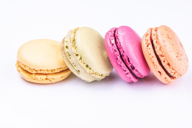 Colorful macarons isolated on white background