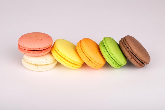 Colorful macarons isolated on white background.