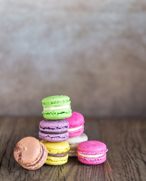 Colorful macarons on the wooden surface