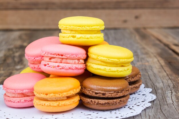 Colorful macaroon on wooden table.