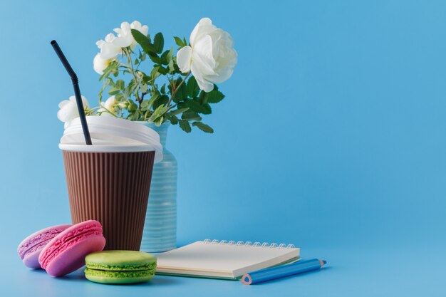 Colorful macaroons and coffee cup