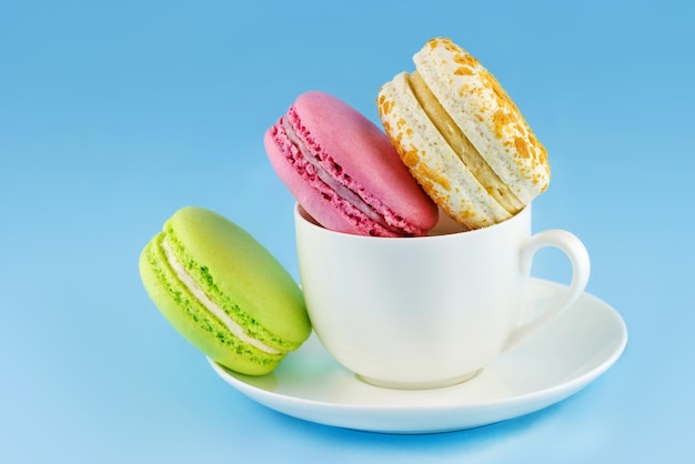 Colorful macaroons in a cup