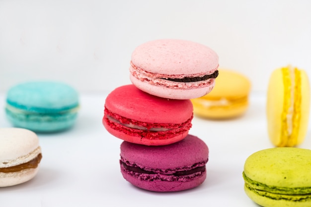 Colorful macaroons on a white table.