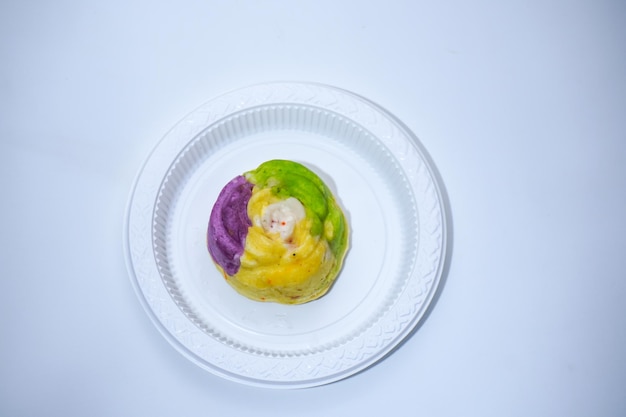 A colorful market snack made from flour and other ingredients called blooming sponge cake