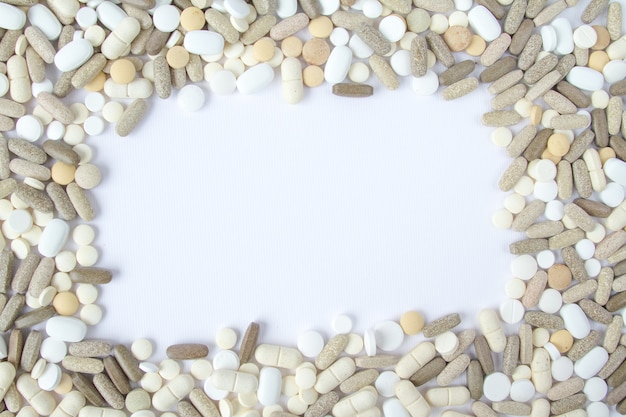 Colorful medical pills loose on a white background.