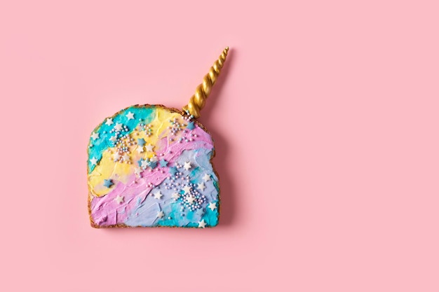 Colorful mermaid and unicorn toast with decoration on pink background