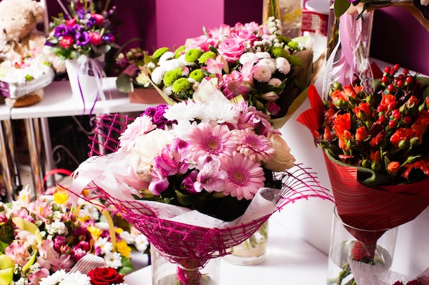Colorful mixed flower bouquets in modern shop