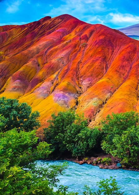 Colorful mountain with a river and trees