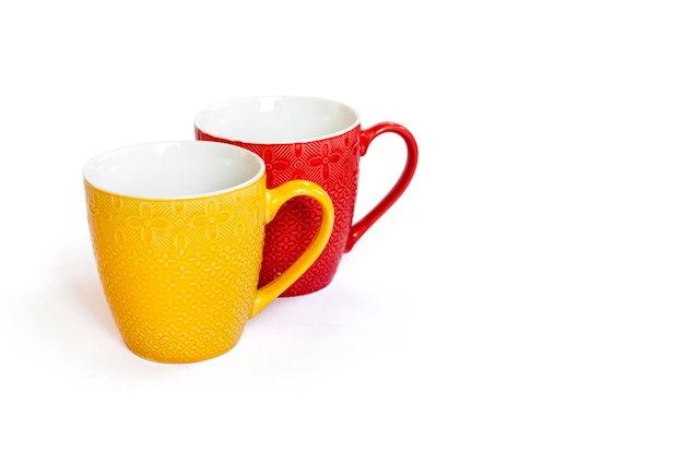 Colorful mugs isolated on white background