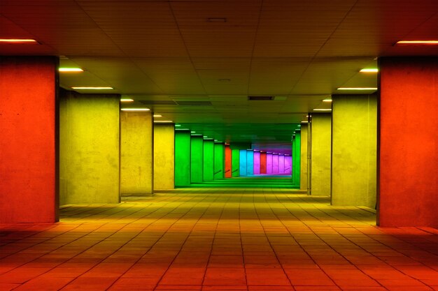 Photo colorful mulitcolord illuminated gallery tunnel near museum park rotterdam the netherlands