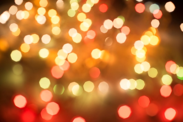 Colorful multi-colored Christmas lights on a dark background