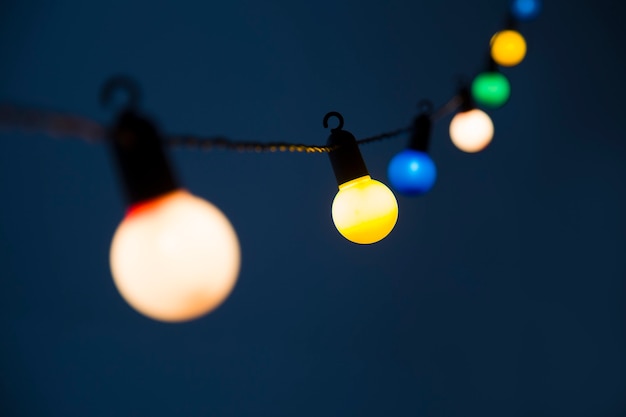 Colorful multi-colored Christmas lights on a dark background